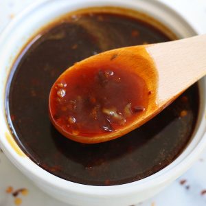 Easy Teriyaki Sauce with bits if red chili pepper flakes and garlic.