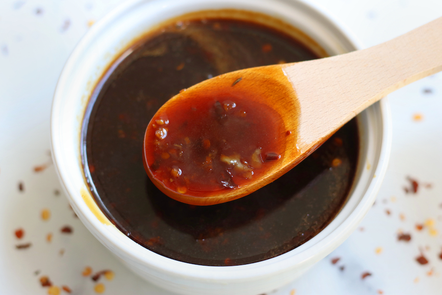 Easy Teriyaki Sauce with bits if red chili pepper flakes and garlic.