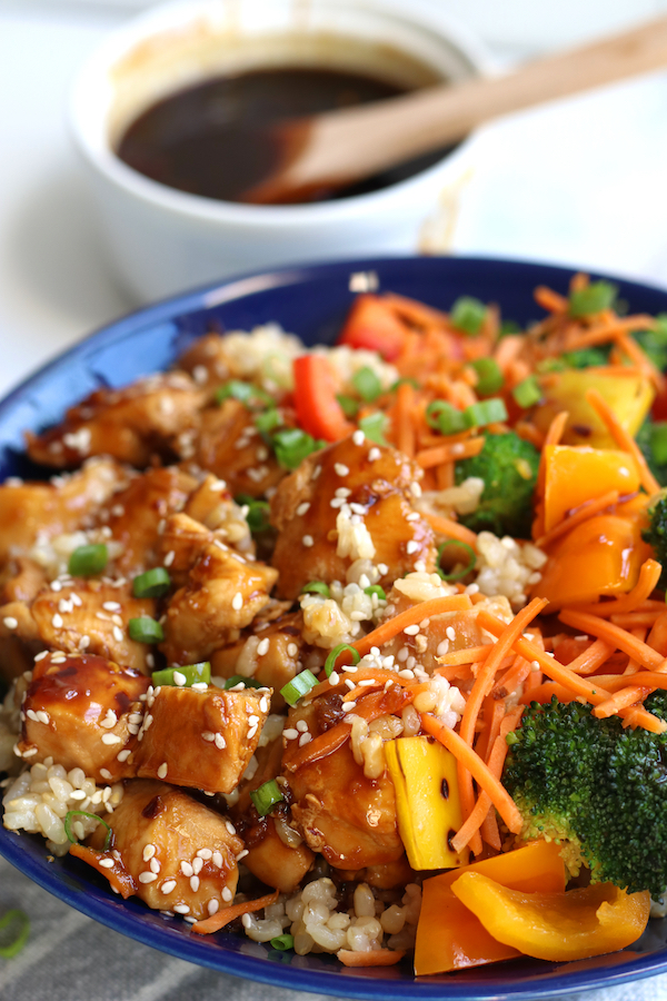 Teriyaki Rice Bowl sitting next to a small bowl of homemade teriyaki sauce.