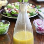 Apple Cider Vinegar Dressing in a bottle with a spout.