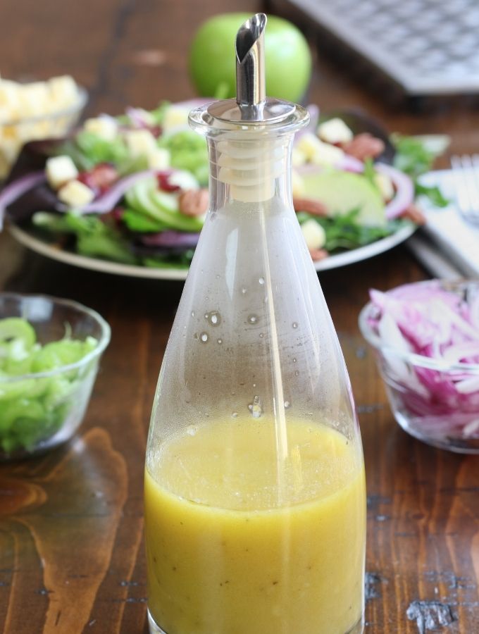 Apple Cider Vinegar Dressing in a bottle with a spout.