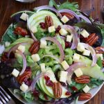 Overhead photo of Apple Pecan Salad dressed with a homemade Apple Cider Vinegar Dressing.