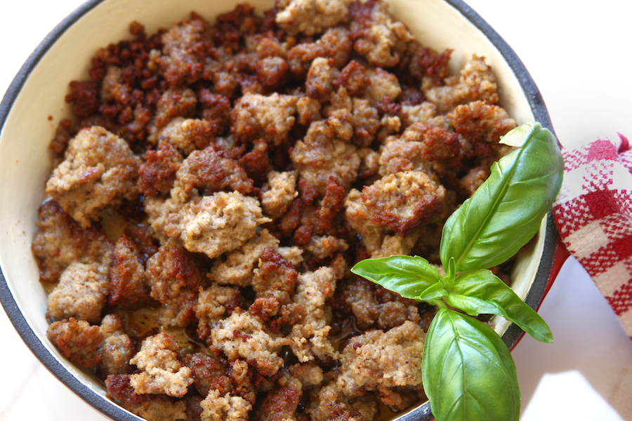 Cooked sausage crumbles in a enameled frying pan from The Fed Up Foodie Italian Sausage Recipe.