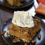 A square of Pumpkin Crisp with a big dollop of homemade whipped cream.