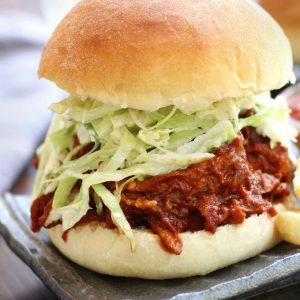 BBQ Pulled Chicken Burger with a fluffy hamburger bun and coleslaw.