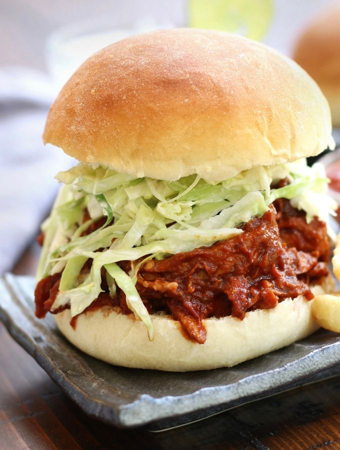 BBQ Pulled Chicken Burger with a fluffy hamburger bun and coleslaw.
