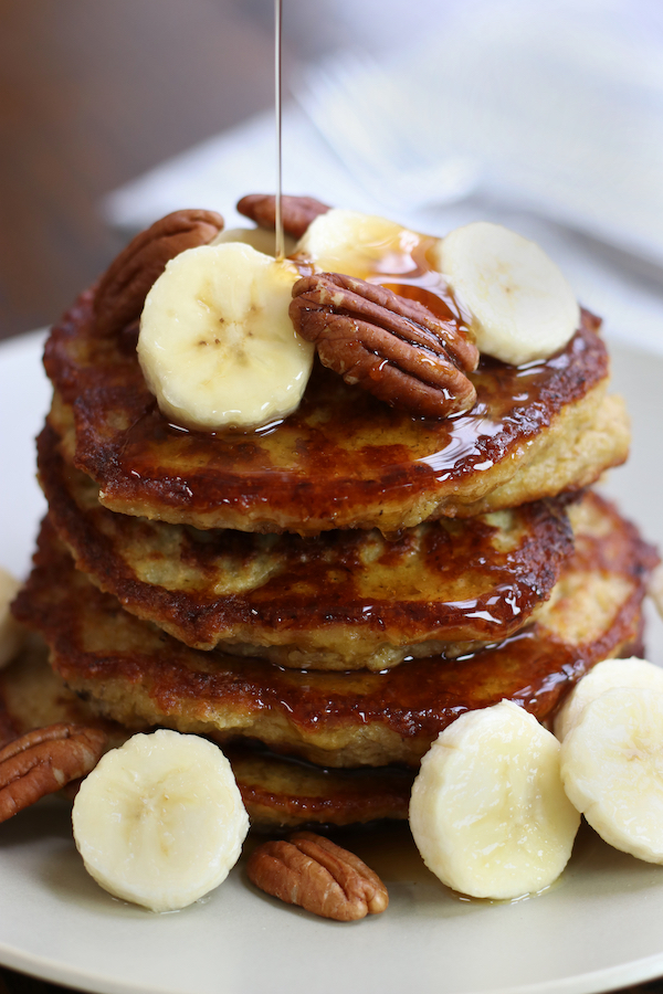 Banana and Oat Pancakes drizzled with maple syrup.