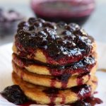 Blueberry Compote on top of a stack of Oat Flour Pancakes.