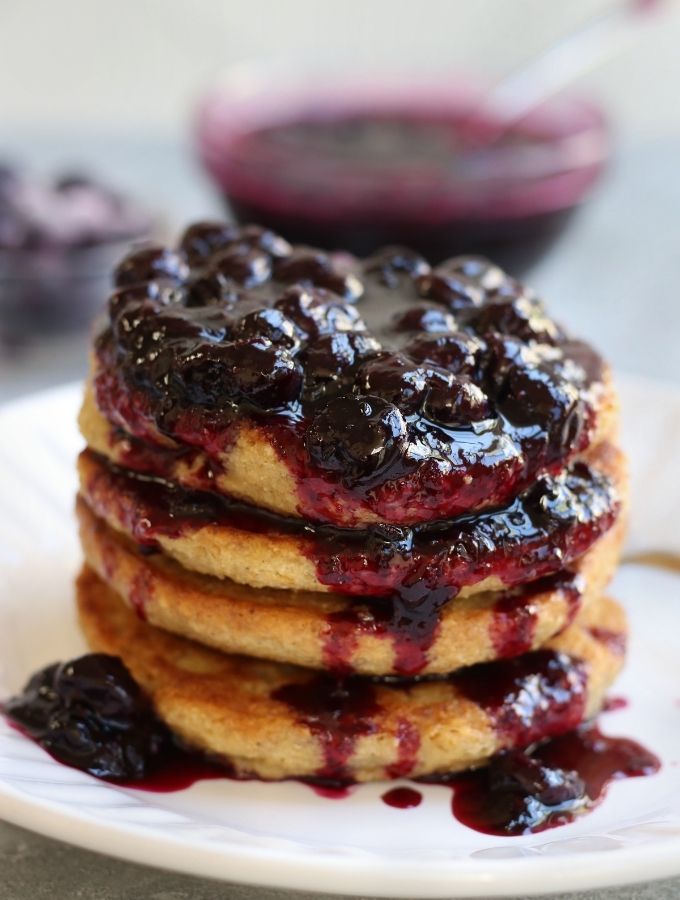 Blueberry Compote on top of a stack of Oat Flour Pancakes.