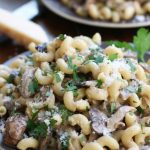 Creamy Mushroom Pasta with curly noodles, parmesan and parsley.