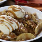 Old Fashioned Apple Crisp served in a white bowl.