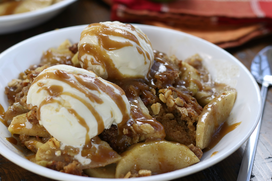 Old Fashioned Apple Crisp served in a white bowl.