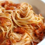 Pomodoro Sauce Recipe served in a white pasta bowl with angel hair pasta.