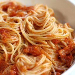 Pomodoro Sauce Recipe served in a white pasta bowl with angel hair pasta.
