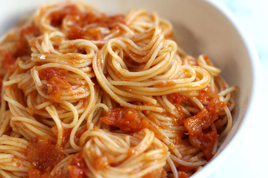 Pomodoro Sauce Recipe served in a white pasta bowl with angel hair pasta.