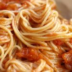 Up close photo of Simple Pomodoro Sauce served over angel hair pasta.