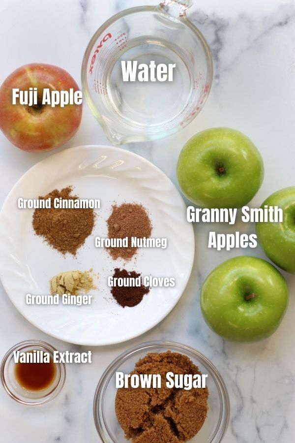 Ingredients for Apple Compote on a white countertop.