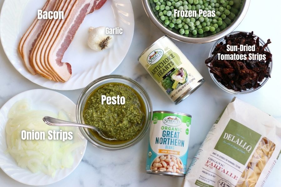 Ingredients for Pasta with White Beans laying on a countertop.