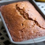 Moist Banana Bread that is made with oil sitting in a loaf pan.