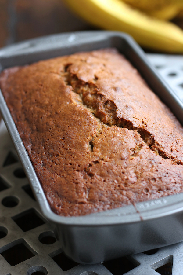 Moist Banana Bread that is made with oil sitting in a loaf pan.