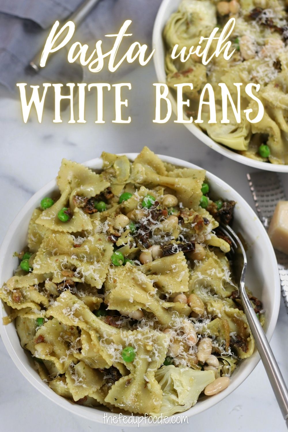 Pasta with White Beans is a perfect under 30 minute meal to throw together for company or if you are craving a scrumptious Italian meal. A satisfying pasta dish that is loaded with the flavors of bacon, pesto and sun-dried tomatoes. 
#PatsaWithWhiteBeans #CanelliBeanRecipe #CanneliBeansRecipe #PastaWithCannelliniBeans #PastaAndBeansRecipe #WhiteBeanPasta