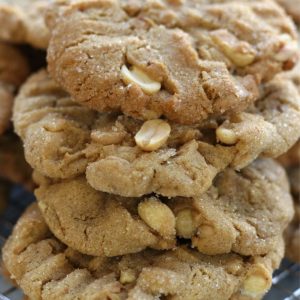 A stack of the Best Peanut Butter Cookies loaded with peanut halves and peanut butter chips.