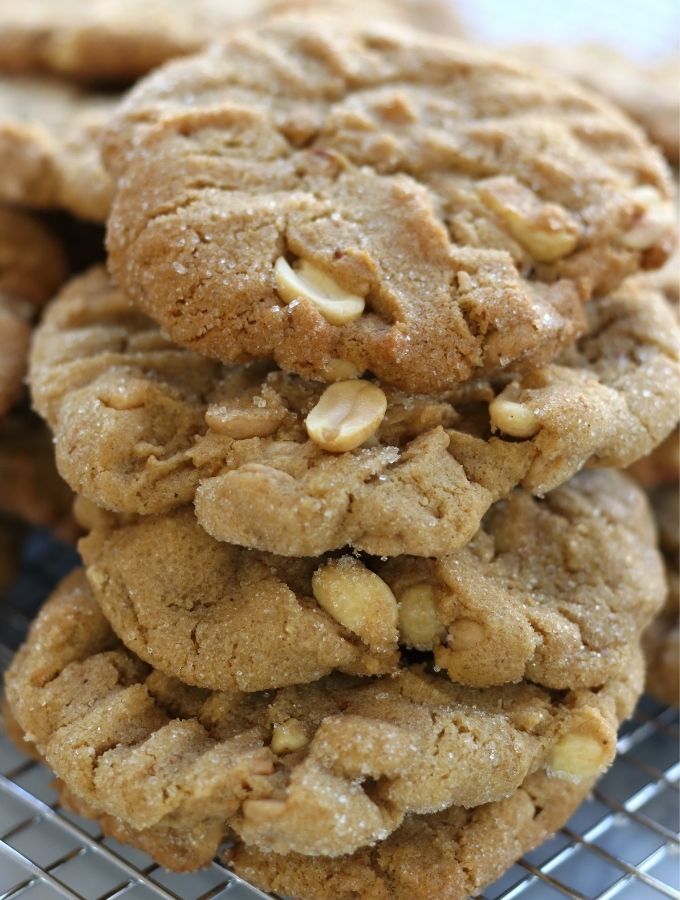 A stack of the Best Peanut Butter Cookies loaded with peanut halves and peanut butter chips.