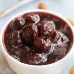 Cherry Amaretto Compote in a small white bowl.