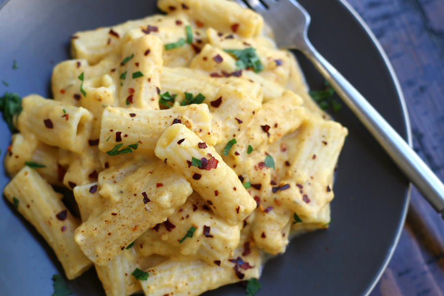 Overhead photo of Healthy Mac and Cheese garnished with red pepper flakes.