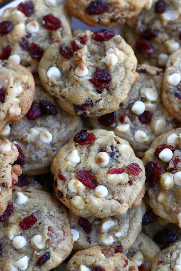 A platter full of White Chocolate Chip Cookies with Cranberries.