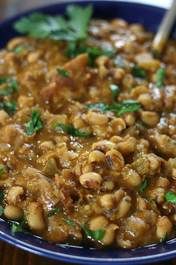 A serving of Black Eye Peas Soup Recipe in a blue bowl.