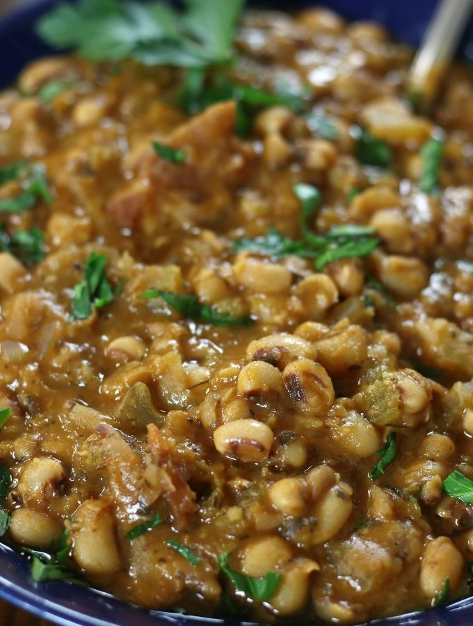 Up close photo of Black Eyed Pea Soup garnished with fresh parsley.
