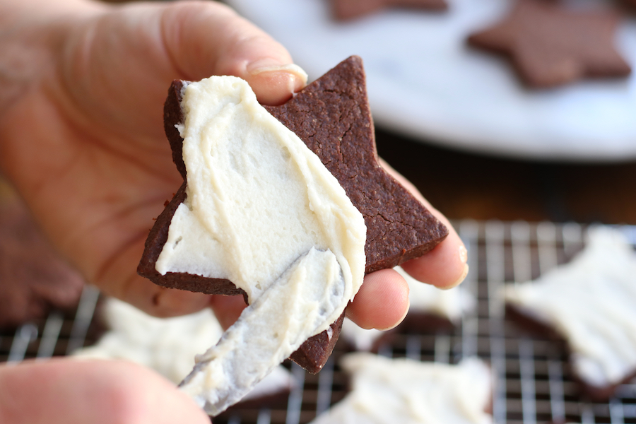 Frosting a Chocolate Sugar Cookies cut out.