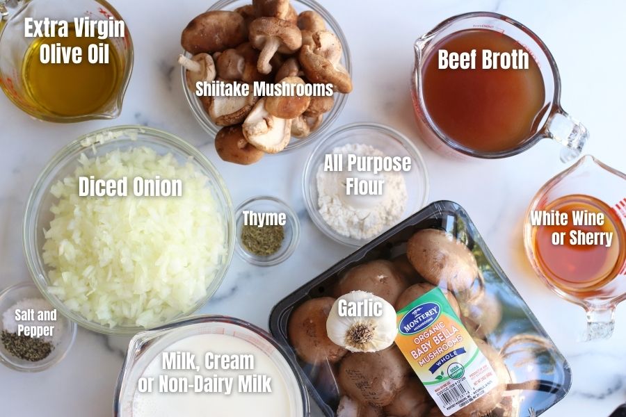 Ingredients for Homemade Cream of Mushroom Soup on top of a white marble countertop.