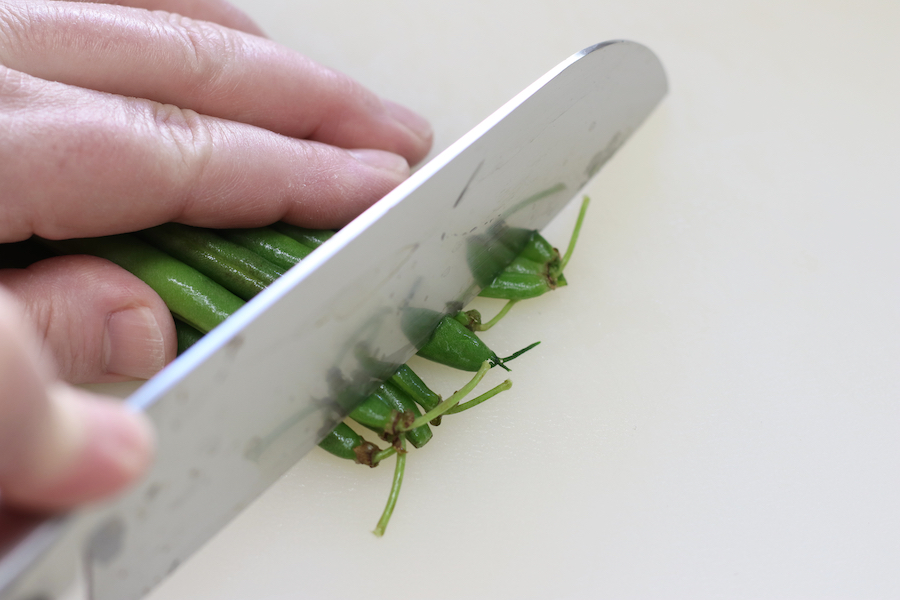 Preparing green beans for Green Bean Stir Fry