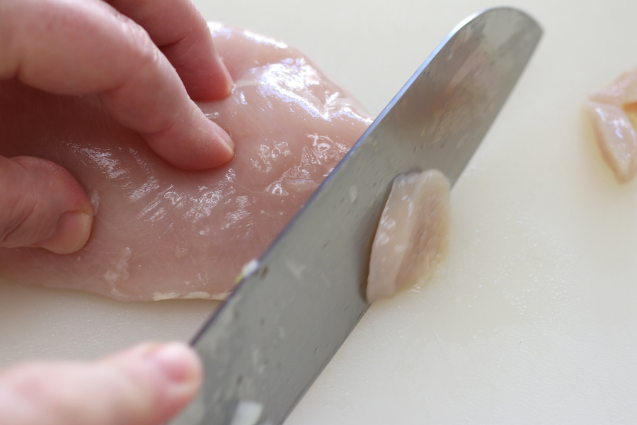 Slicing chicken breast for Green Bean Stir Fry.