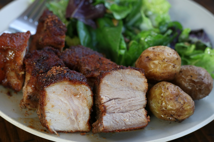 Boneless Country Style Ribs with Dry Rub and baked in the oven on a plate.