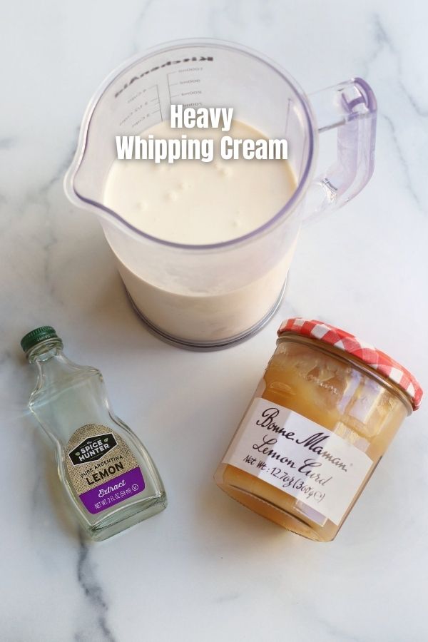 Ingredients for Lemon Curd Whipped Cream on a white countertop.