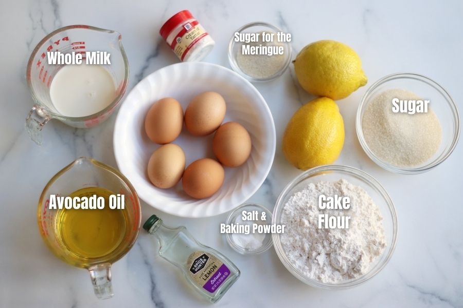 Overhead photo of the ingredients for Lemon Roll Cake laying on a white countertop.