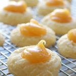 Up close photo of Lemon Curd Cookies on a cooling wrack.