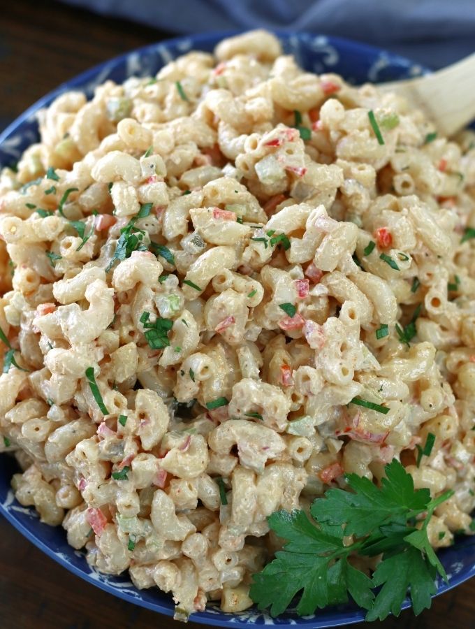 Up close photo of Macaroni Salad garnished with Italian parsley.