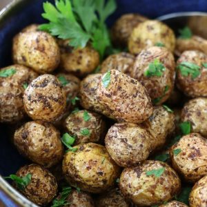 Air Fryer Baby Potatoes garnished with Italian parsley.