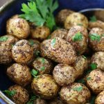 Cooked Air Fryer Creamer Potatoes served in a blue bowl.