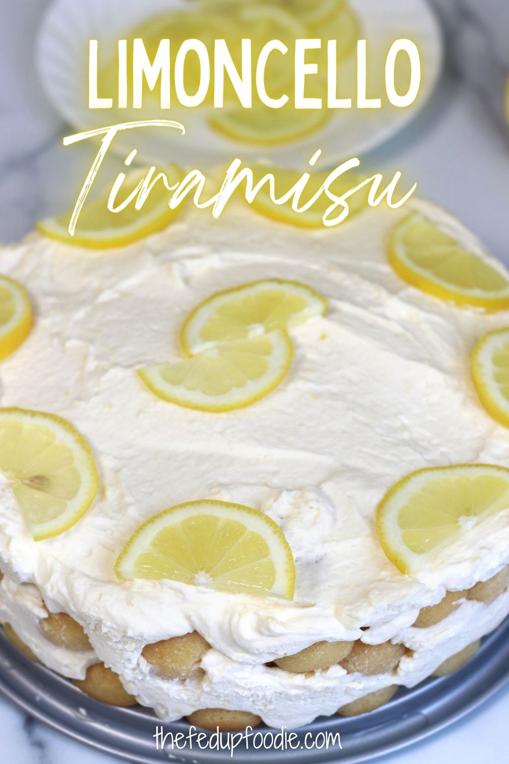 Limoncello Tiramisu has Italian lemon liqueur soaked lady fingers and a  fluffy lemon mascarpone cheese mixture. This is a delightful summery spin off of the classic Tiramisu that is perfect for summer entertaining. A citrusy dessert that is very easy to make and incredibly refreshing. #LimoncelloTiramisu #LimoncelloTiramisuRecipe #LimoncelloTiramisuLemonCurd #LemonyLimoncelloTiramisu #LimoncelloTiramisuLemonCurd #LemoncelloTiramisuRecipe #LimoncelloDesserts #LemonTiramisuRecipe