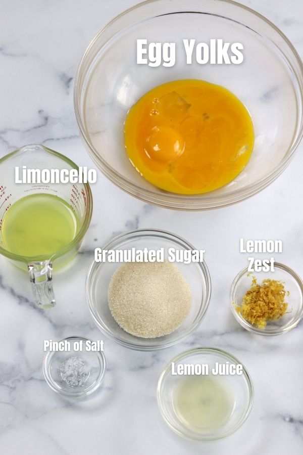 Ingredients for Lemon Zabaglione portioned out on a white countertop.