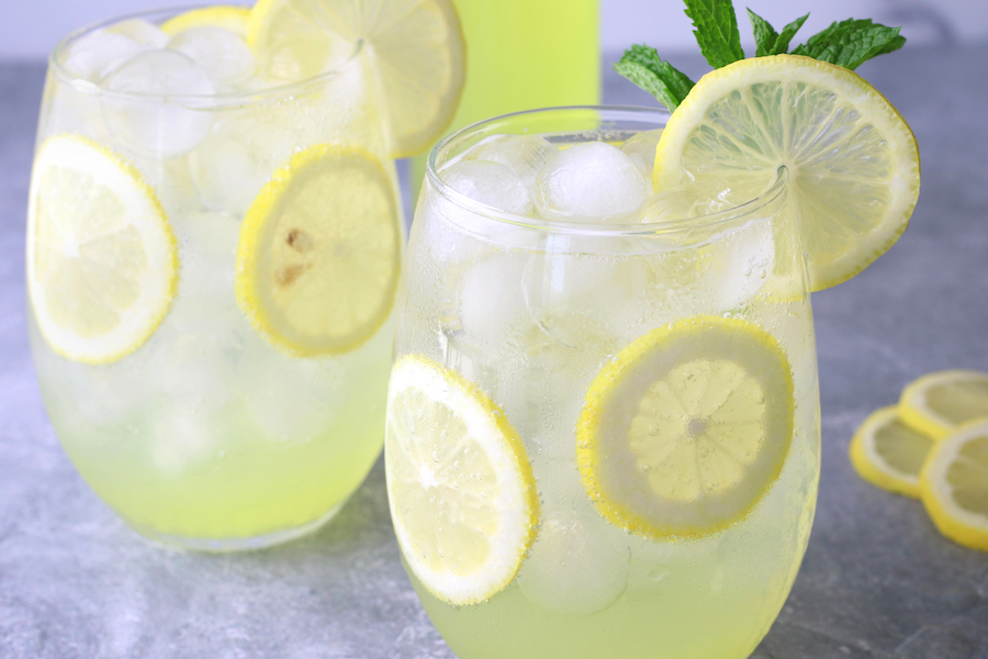 Two glasses of Limoncello over ice with Prosecco and sparkling water.