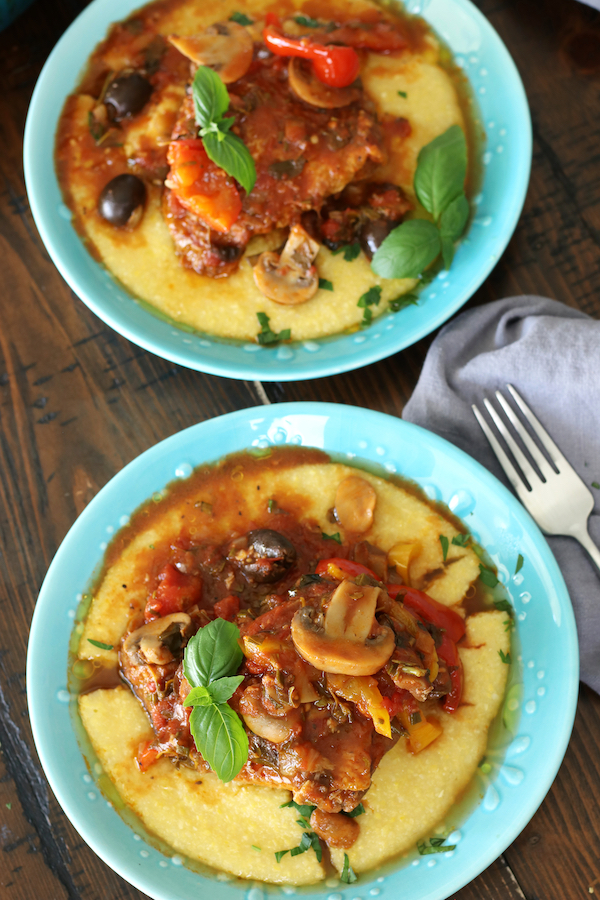 Overhead photo of Pollo alla Cacciatore garnished with basil leaves.