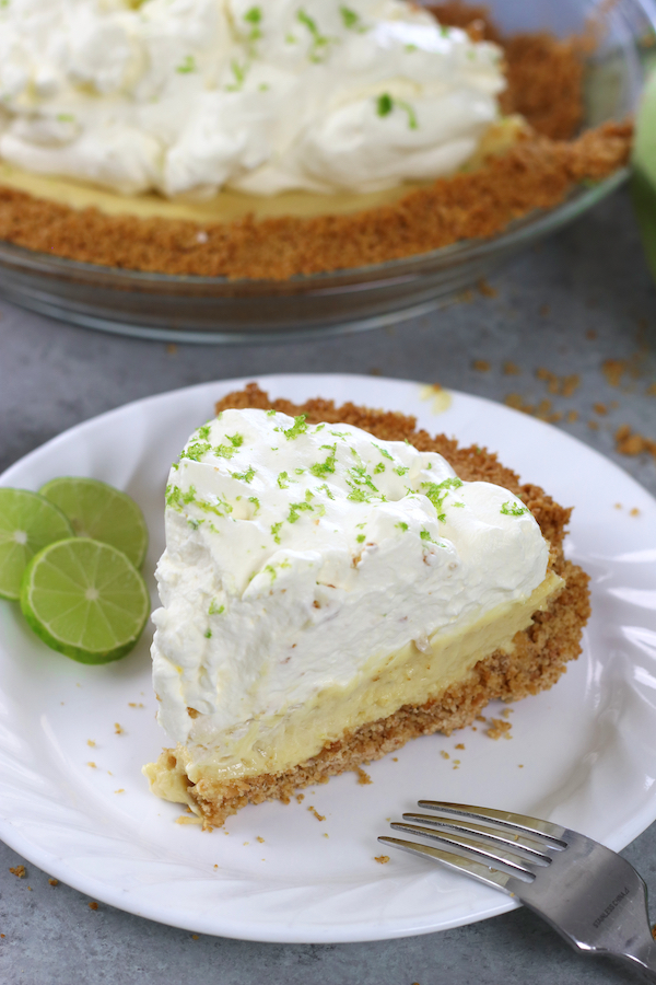 A slice of Easy Key Lime Pie on a white plate.