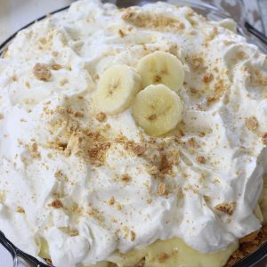 Banana Cream Pie made with pudding and garnished with graham cracker crumbs and banana slices.