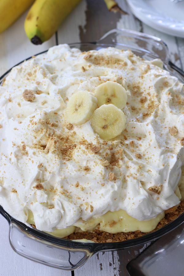 Banana Cream Pie made with pudding and garnished with graham cracker crumbs and banana slices.